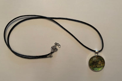 Silver New York City map pendant with black cord necklace