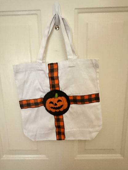 White Canvas Halloween Sack with Pumpkin Face and Checked Ribbon Trim